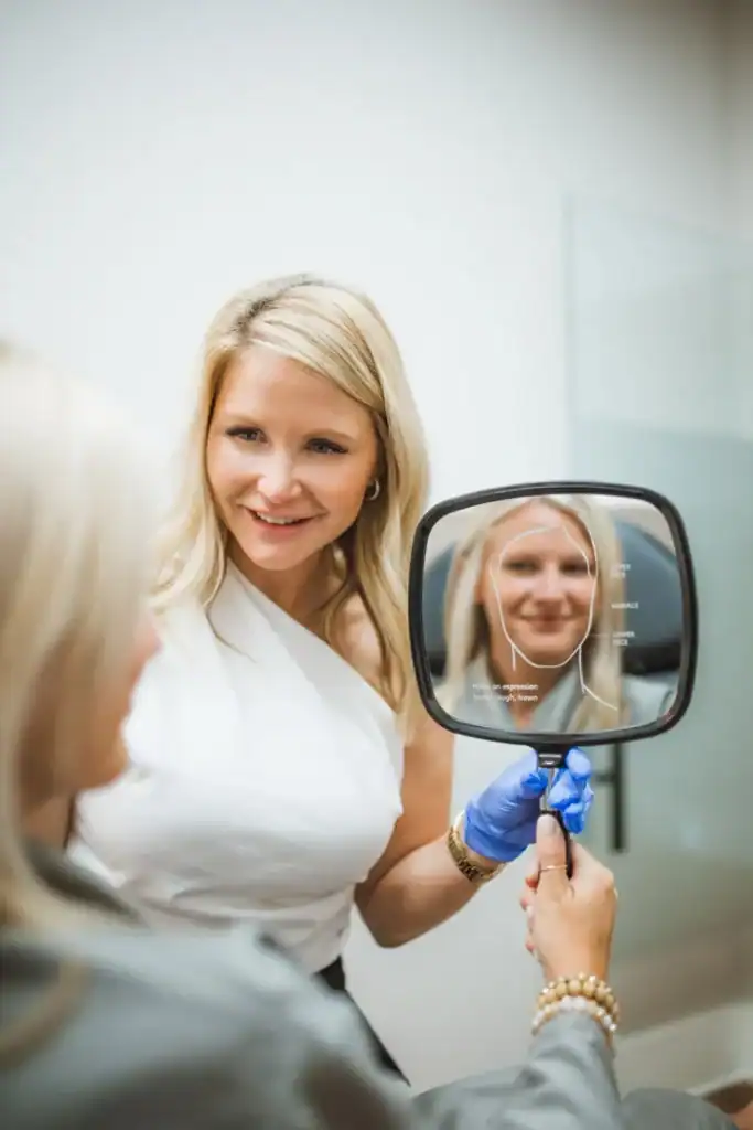 Clear skin consultation with a medical aesthetic professional at Brooke Nix Medical Aesthetics, focusing on facial analysis and personalized skincare solutions for natural beauty enhancement.